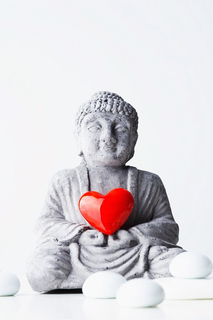 Buddha statue with red heart
