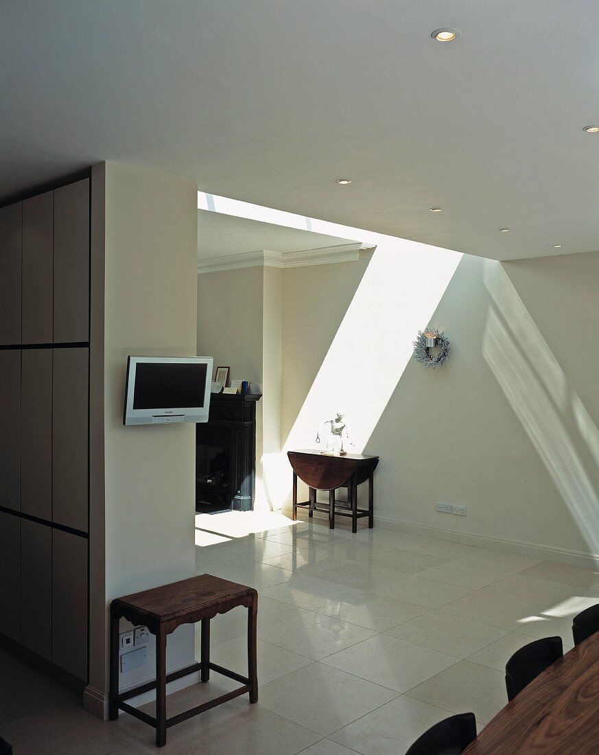 Open-plan living space with skylight