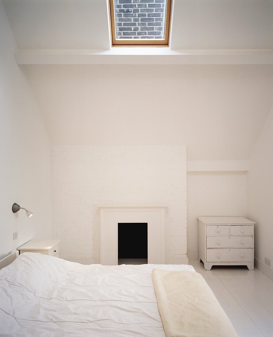White bedroom with skylight