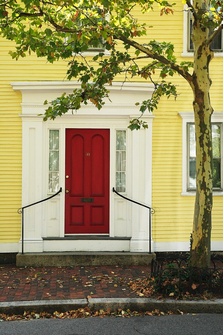Yellow house with red front door
