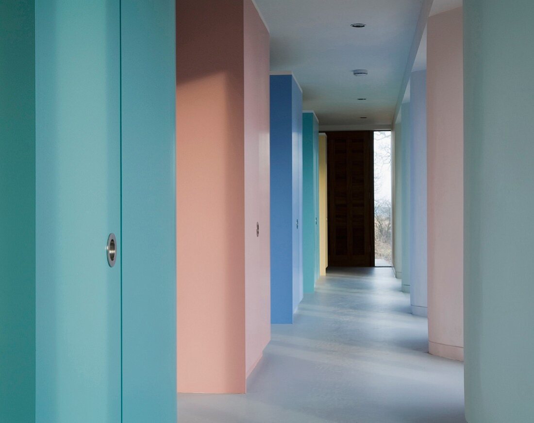 Rainbow of pastel shades on wall elements in modern hallway