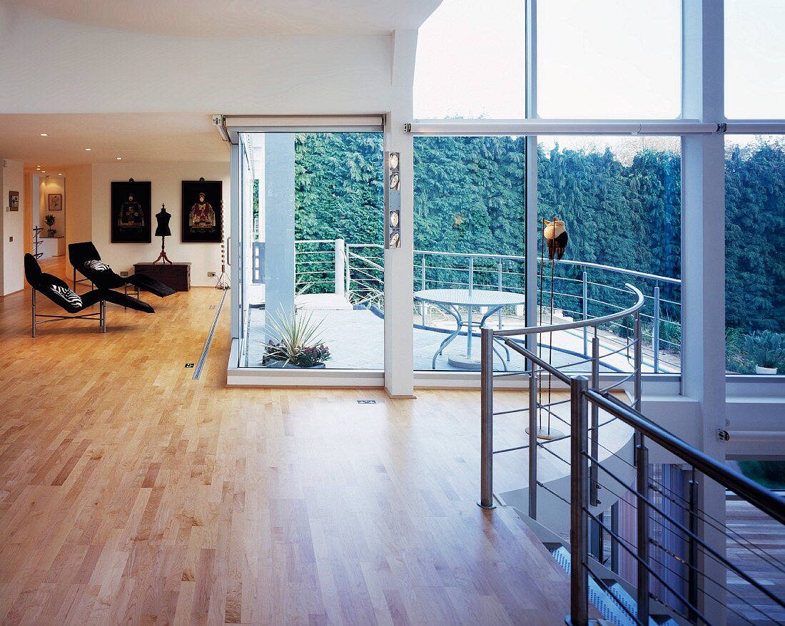 Large living room with glass wall and balcony