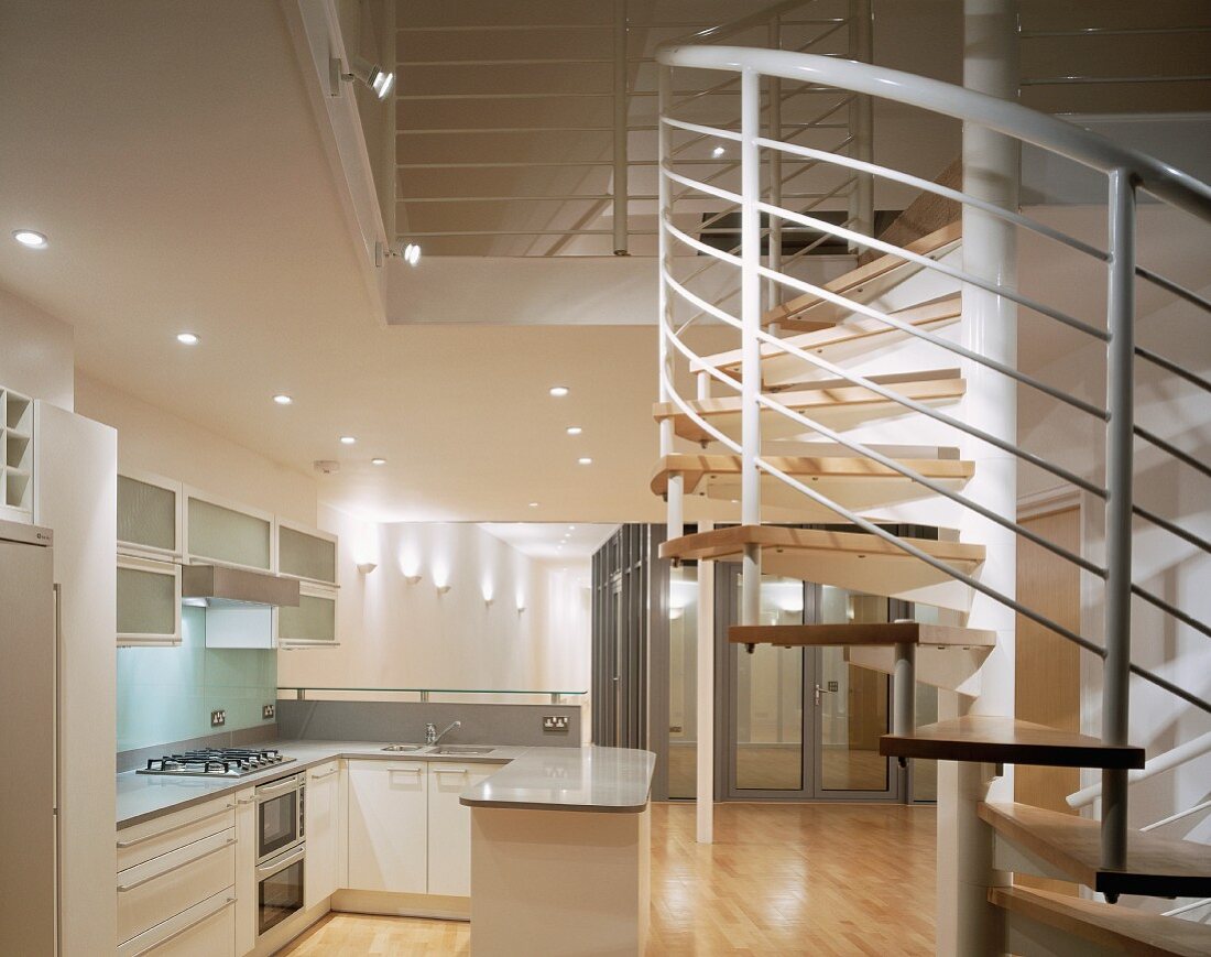 Open-plan kitchen with spiral staircase