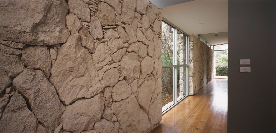 View past limestone wall into hallway