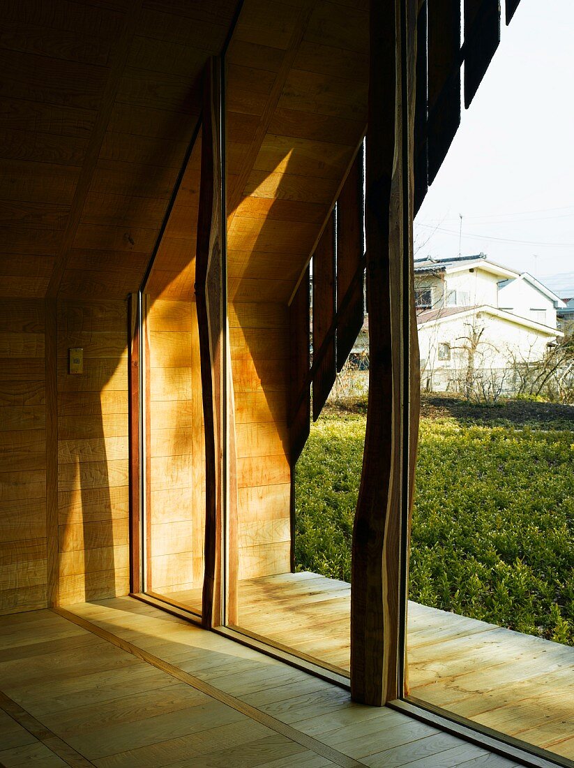View of Japanese garden through glass wall