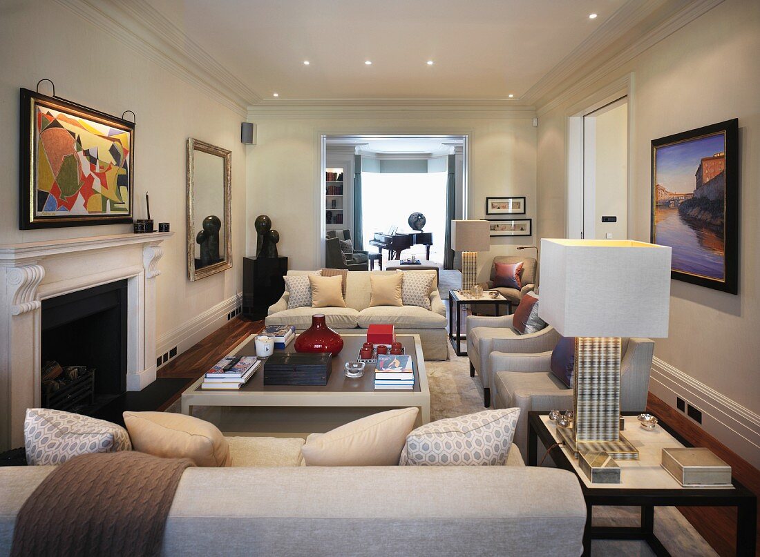Living room with upholstered sofas and coffee table in front of fireplace