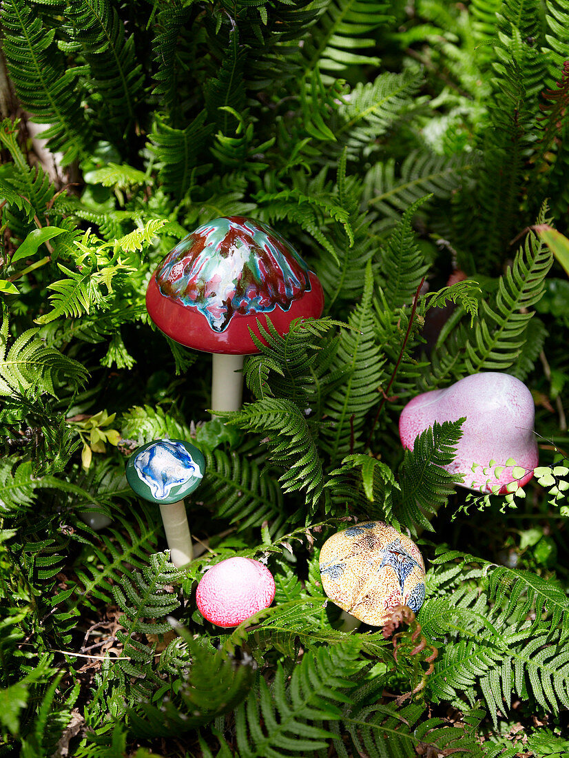 Decorative mushrooms amongst ferns