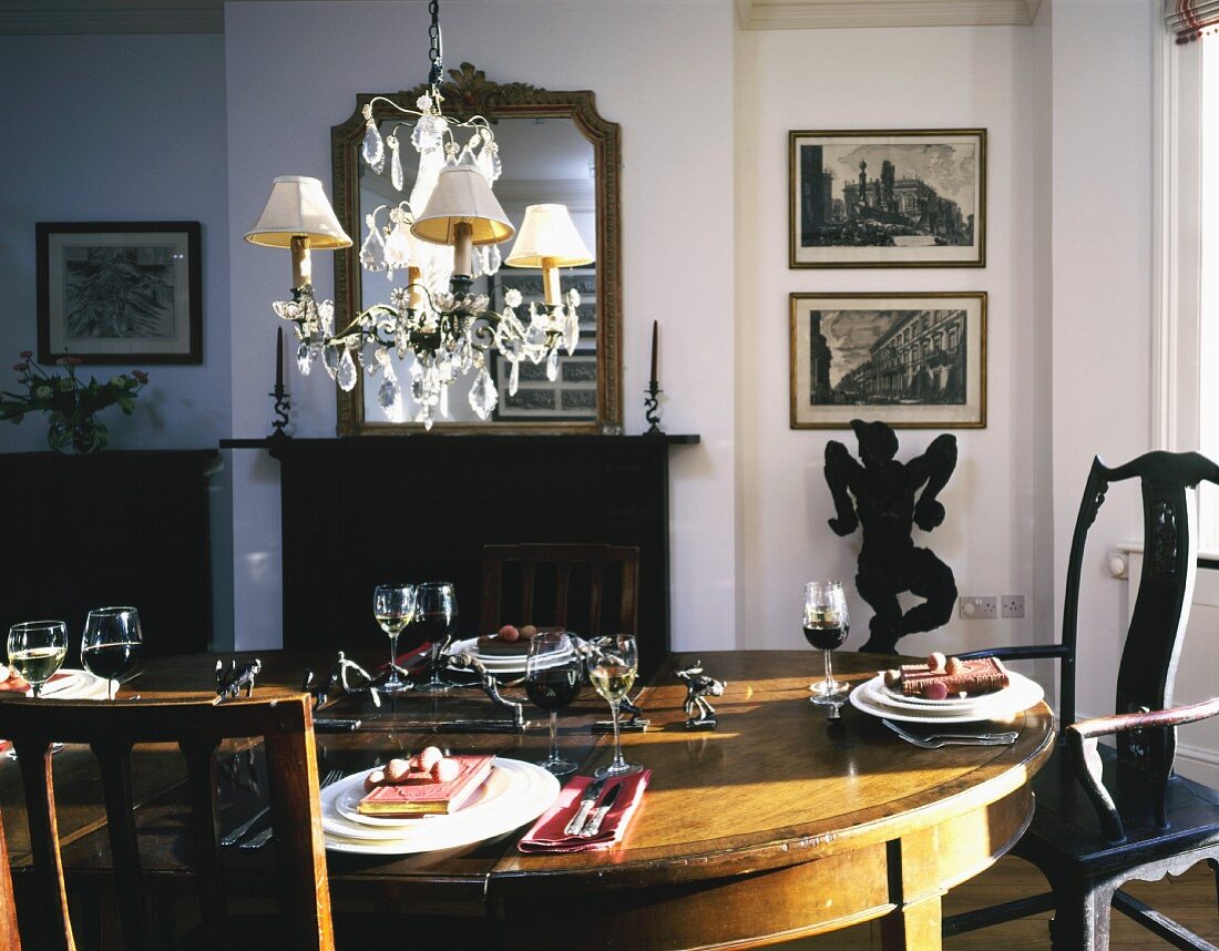 Set table in traditional dining room with fireplace