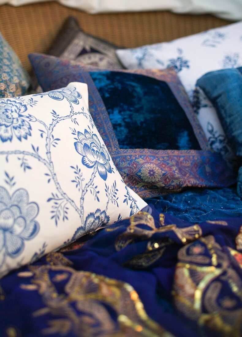 Pillows with white and blue covers and floral pattern