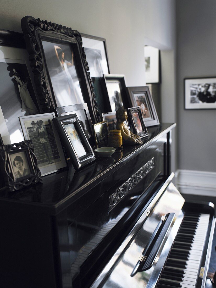 Framed pictures on a piano