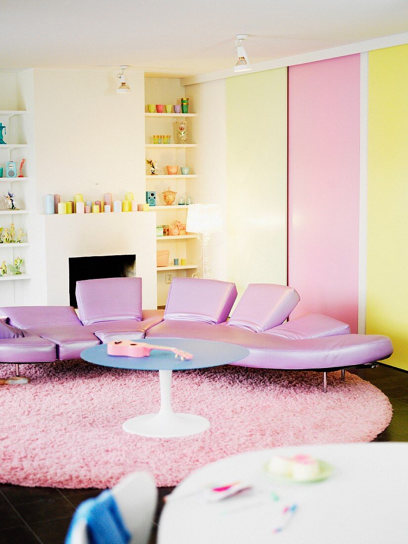 Designer couch with pink leather upholstery in a living room