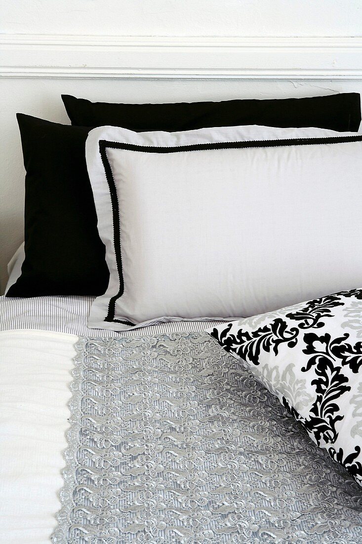 Black and white pillows on bed