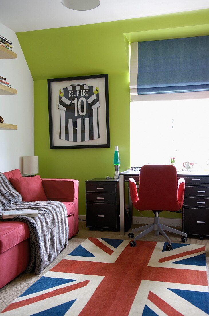 Rug with Union Jack motif in front of desk and window in teenager's bedroom
