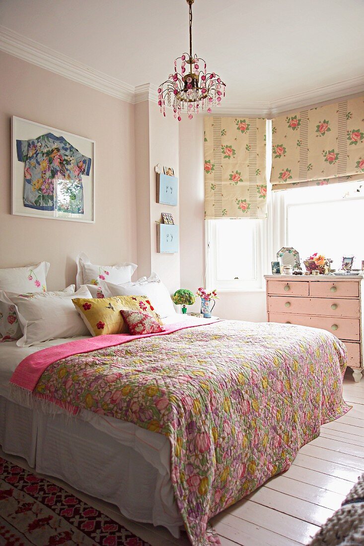 Romantic bedroom with patterned throw on bed