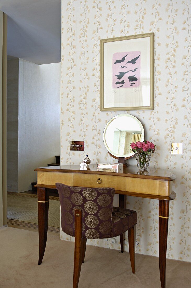 Upholstered chair with elegant silk cover and Biedermeier-style console table