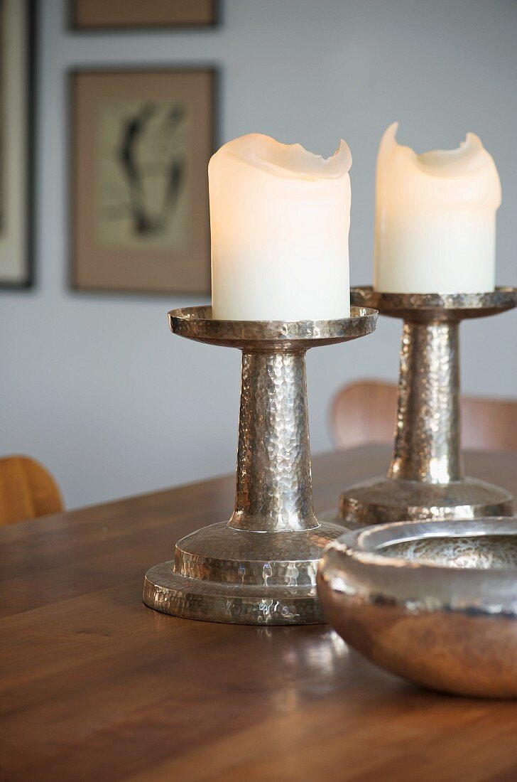 Chunky, hammered silver candlesticks and matching bowl
