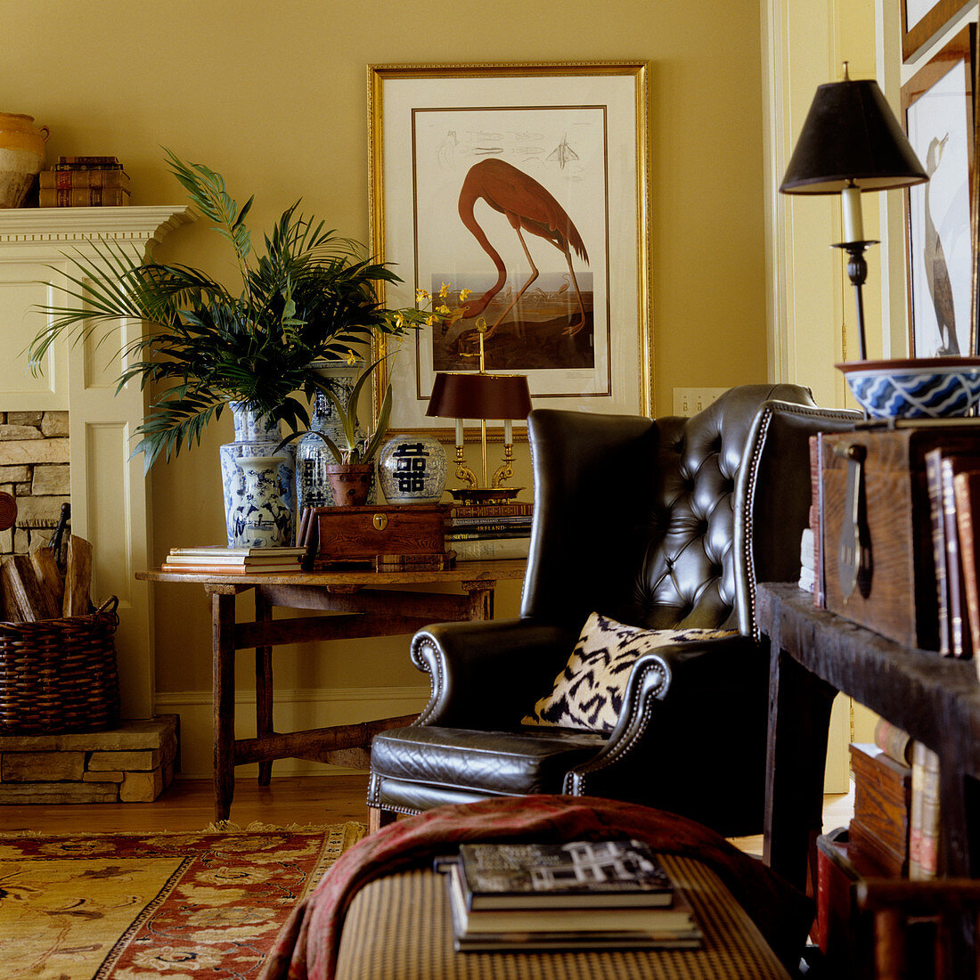 Dark brown leather armchair in corner of traditional living room