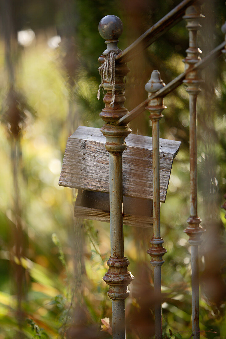 Bird table hanging on metal railing