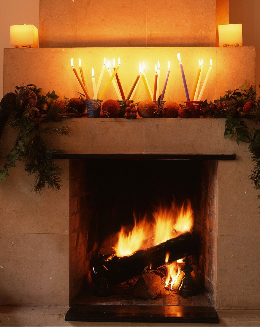 Open fire & Christmas decorations on mantelpiece