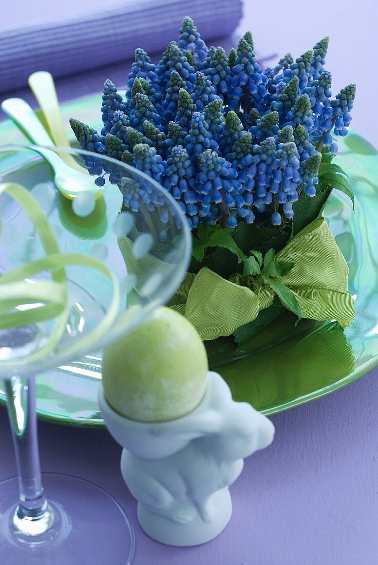 Grape hyacinths and Easter egg in egg cup