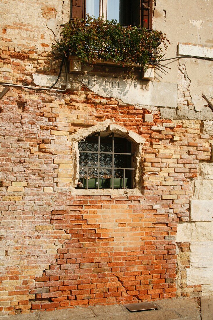 Weathered Wall on Canal in Venice Italy