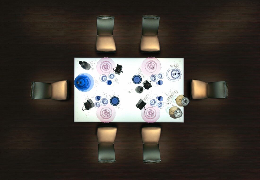 Artistic arrangement of chairs and place settings on table
