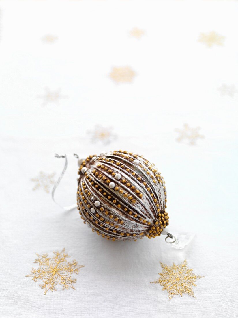 Christmas bauble decorated in silver and gold