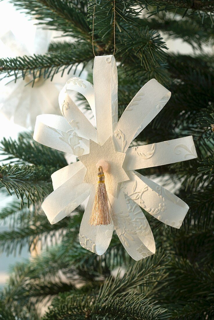 Hand-made paper star as Christmas tree decorations