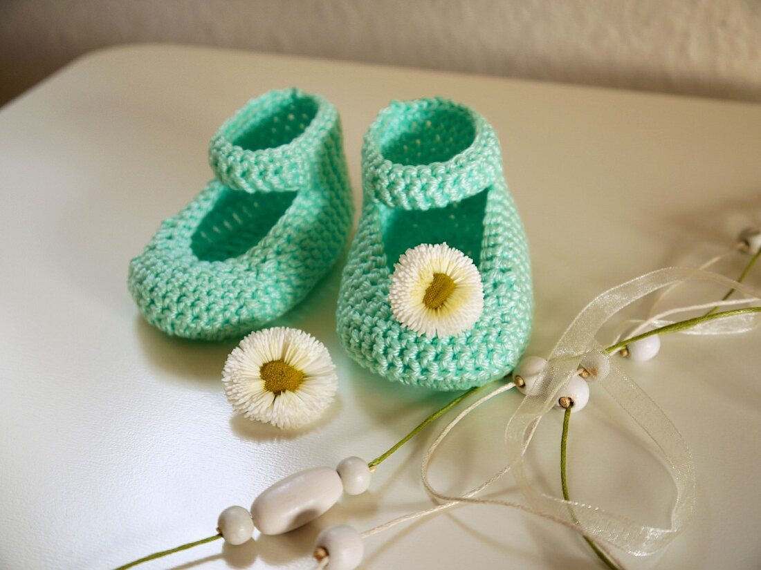 Crocheted baby bootees