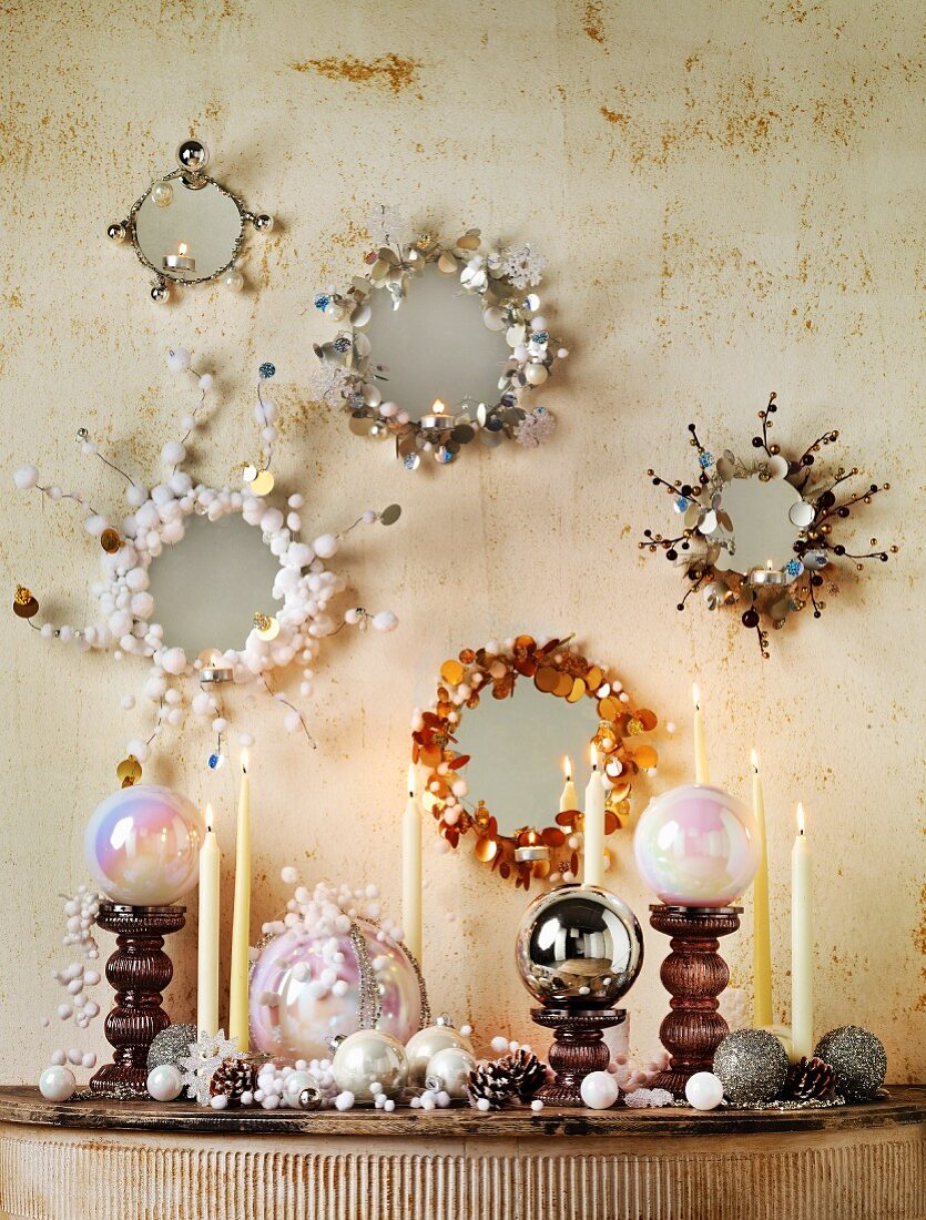 Mirrors with original frames and Christmas decorations on small console table