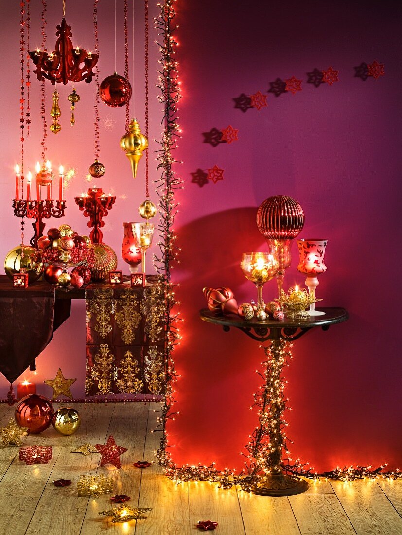 Pink and gold Christmas decorations with candles and fairy lights