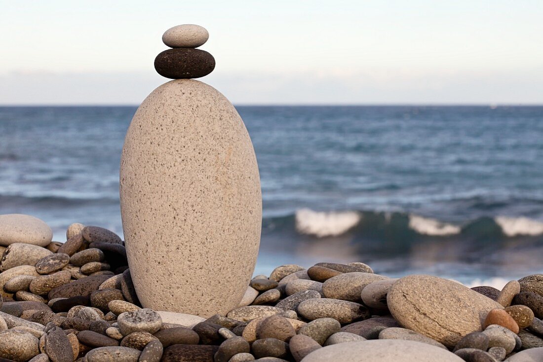 Stack of pebbles on seaside beach