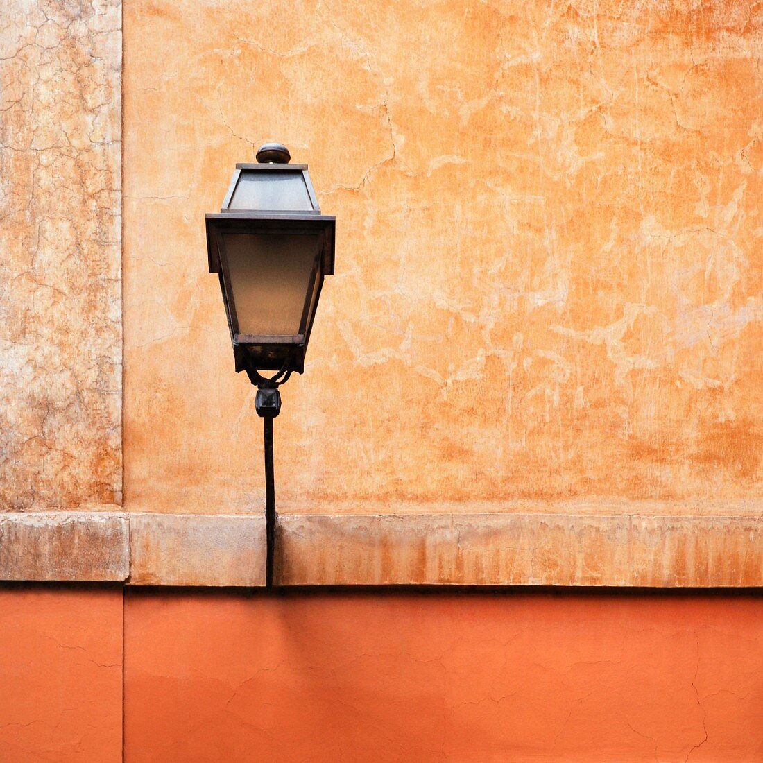 Street lamp on a building facade (Italy)
