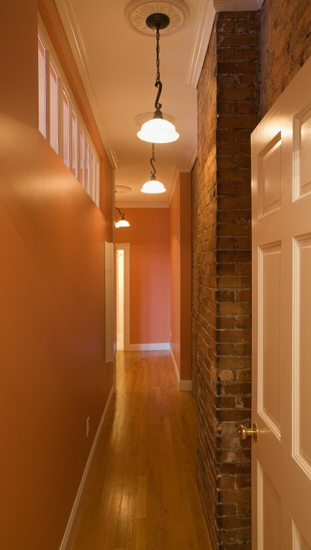 Narrow hallway with hardwood floor