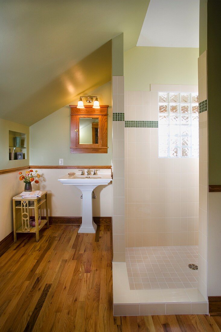 Bathroom with large walk in shower and glass block window