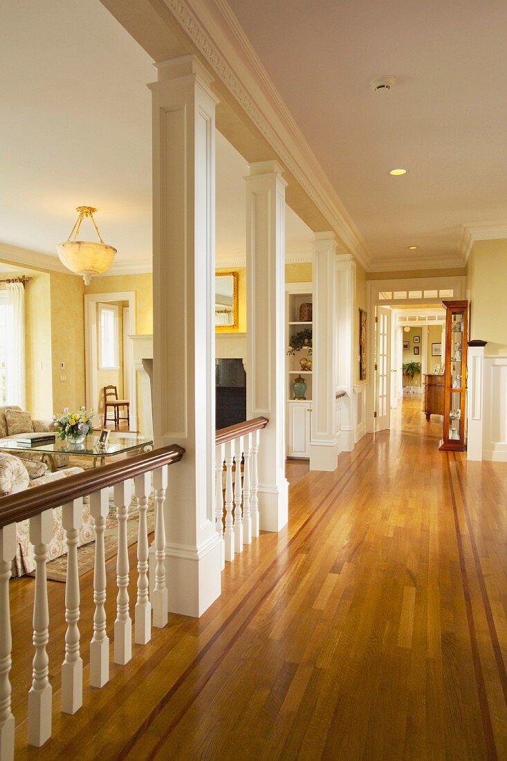 Traditional hallway in home with red oak hardwood floors