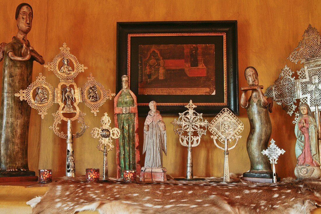 Decorative figurines and crosses on mantle