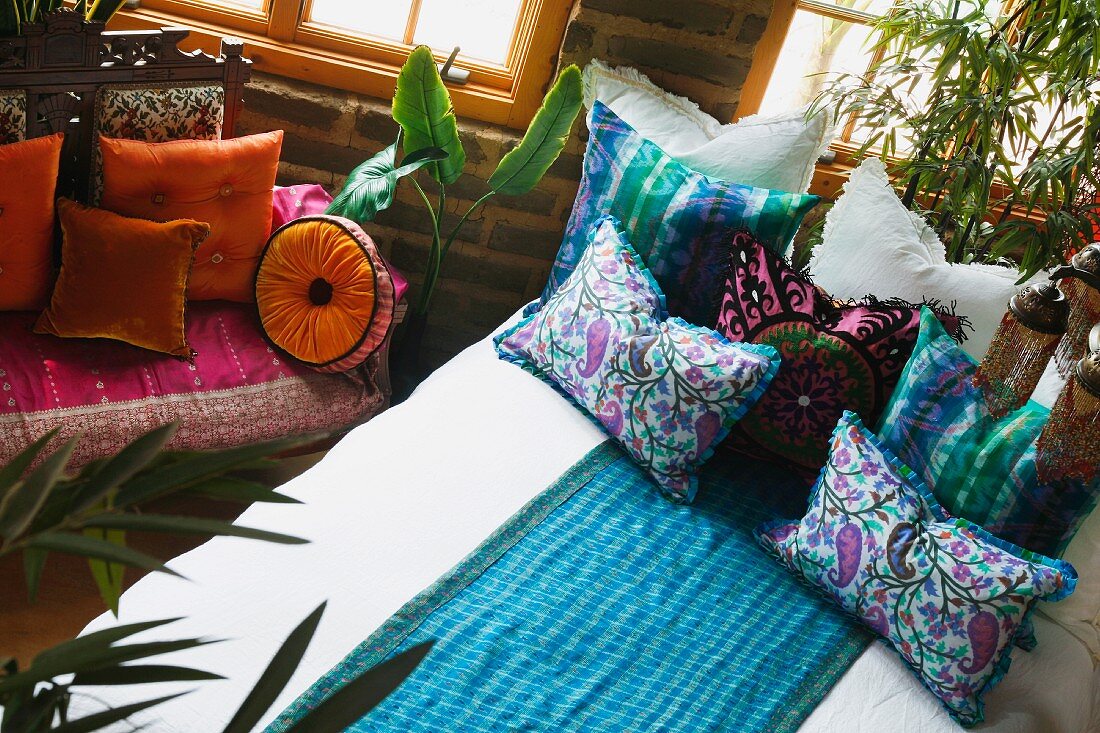 Colorful bed runner and pillows on bed