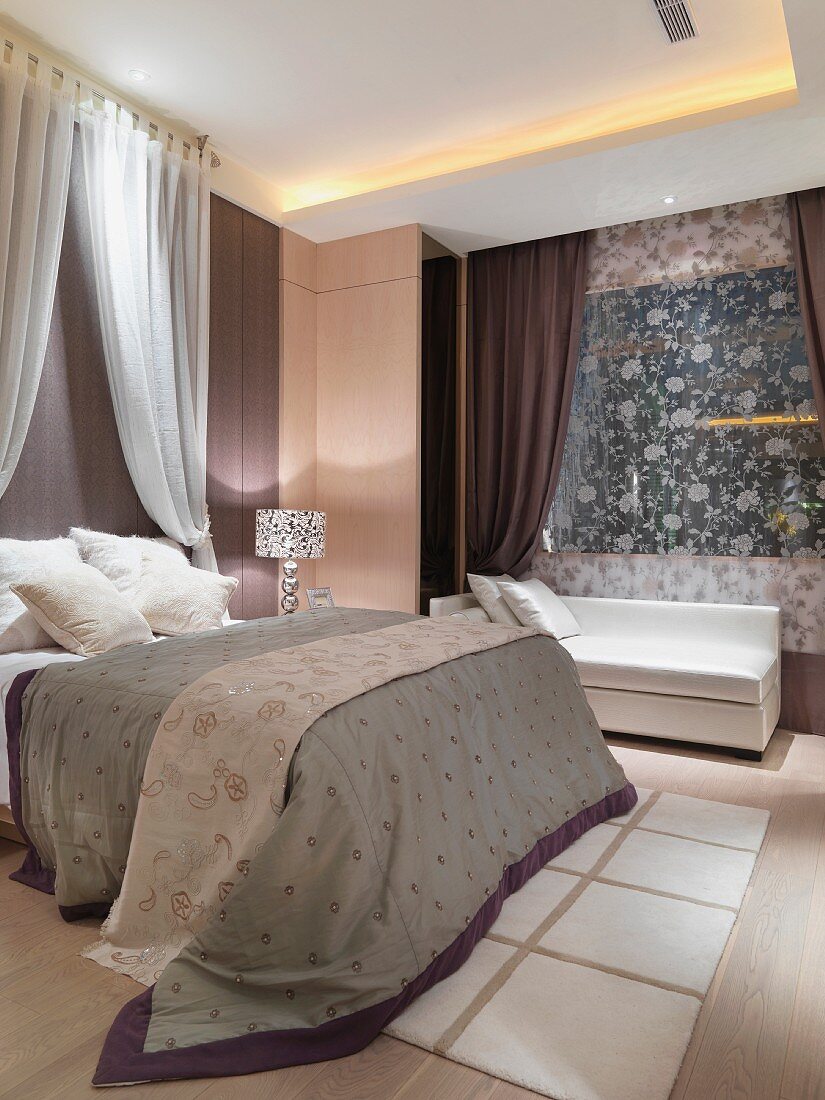 Grand bedroom with double bed and wall hanging