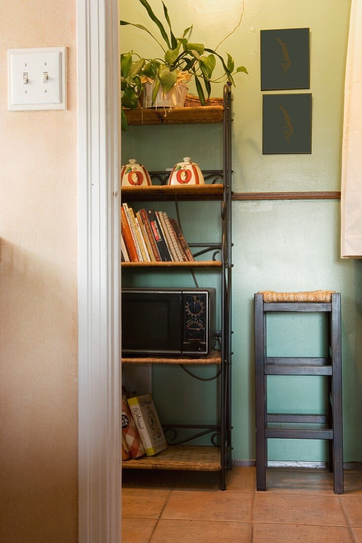 Vignette of kitchen wall unit and stool.