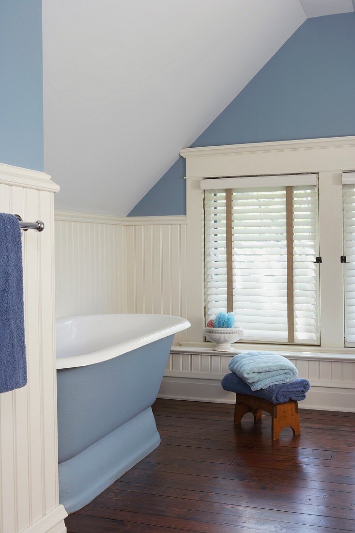 Tranquil, spartan bathroom in pastel blue and white