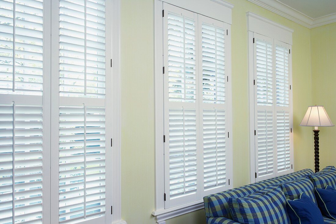 White wall of windows with Venetian blinds