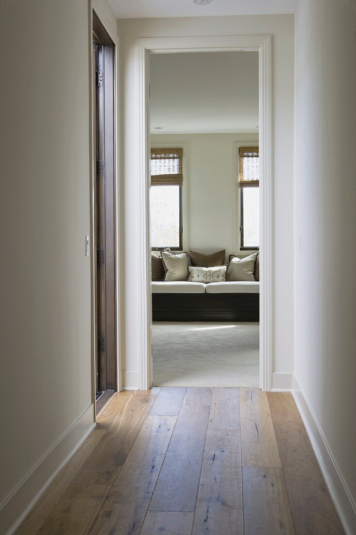 Hardwood floor in hallway leading to sitting area