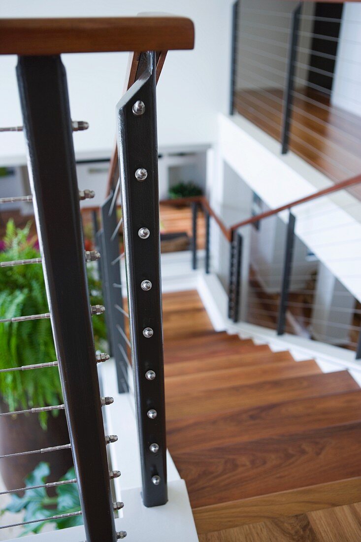 Contemporary Wooden staircase with wire railing