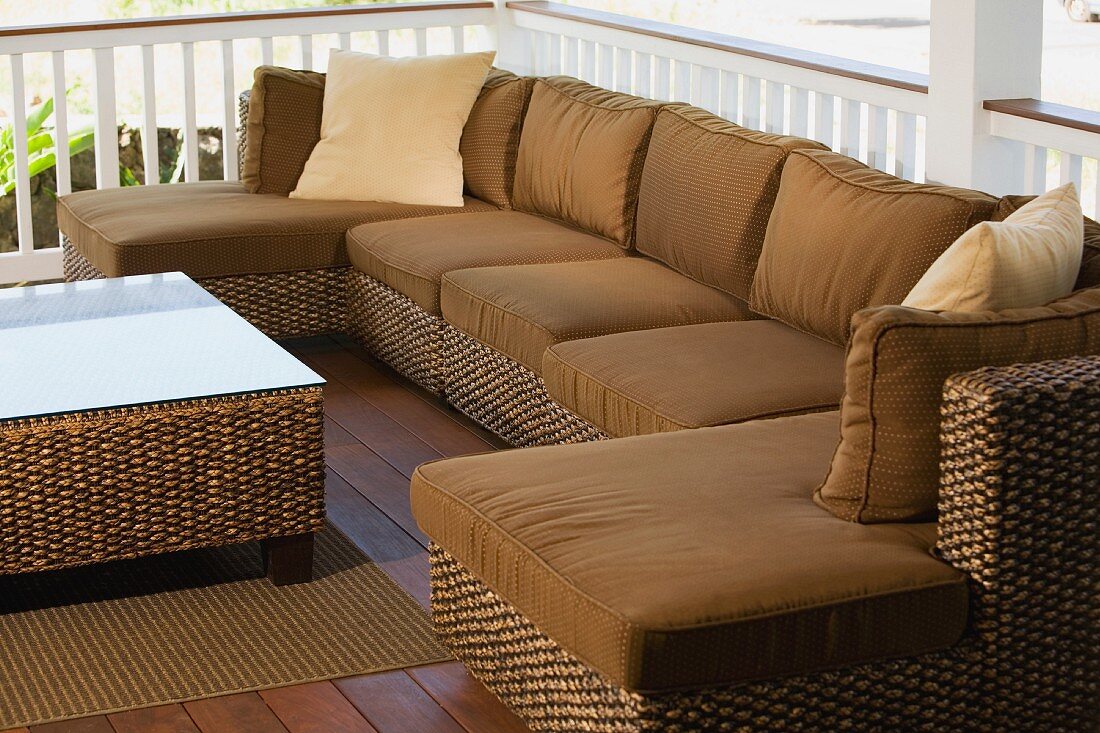 Wicker couch in an outdoor sitting area