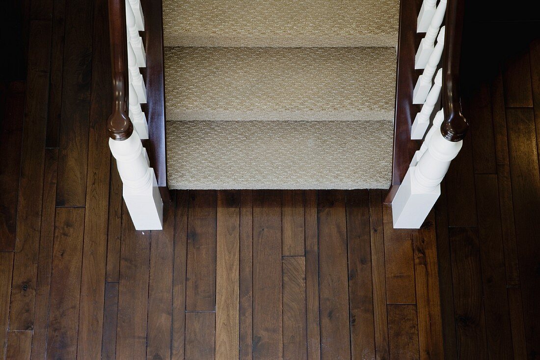 Aerial view traditional carpeted staircase and hardwood floor