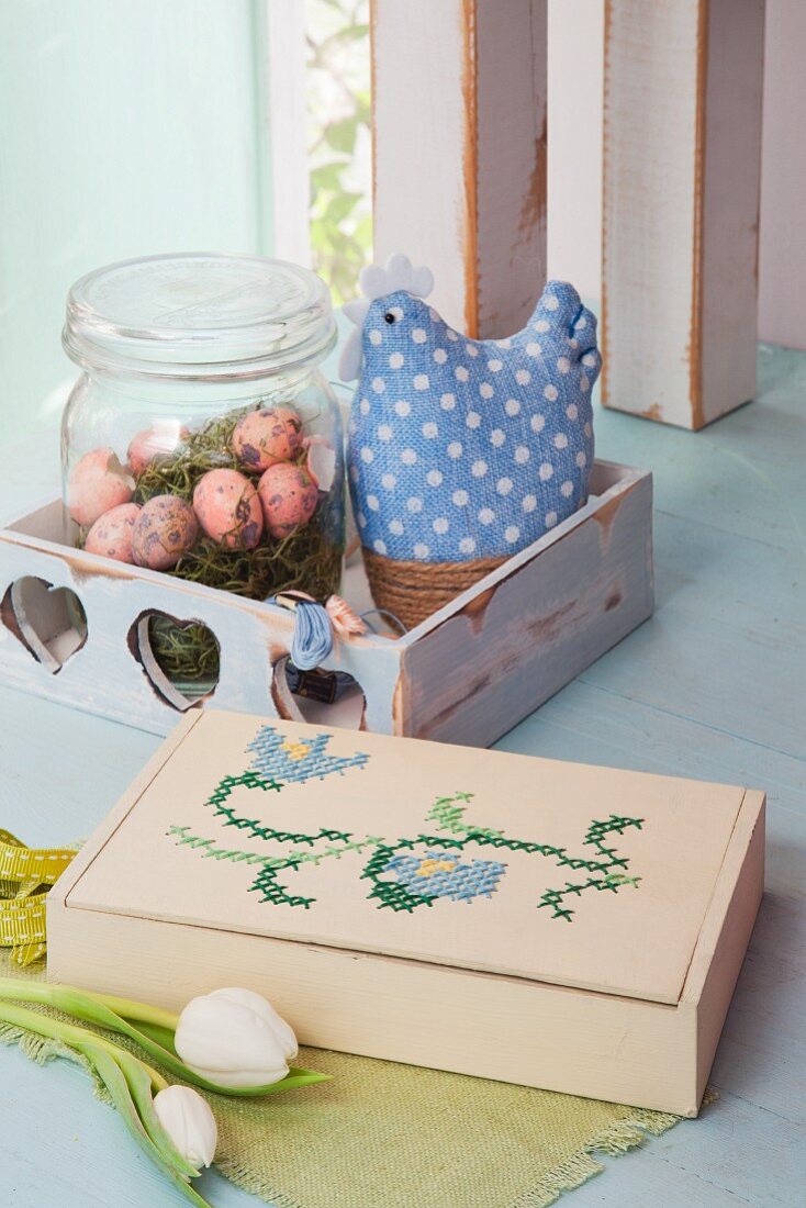 Easter arrangement of embroidered wooden box and vintage accessories