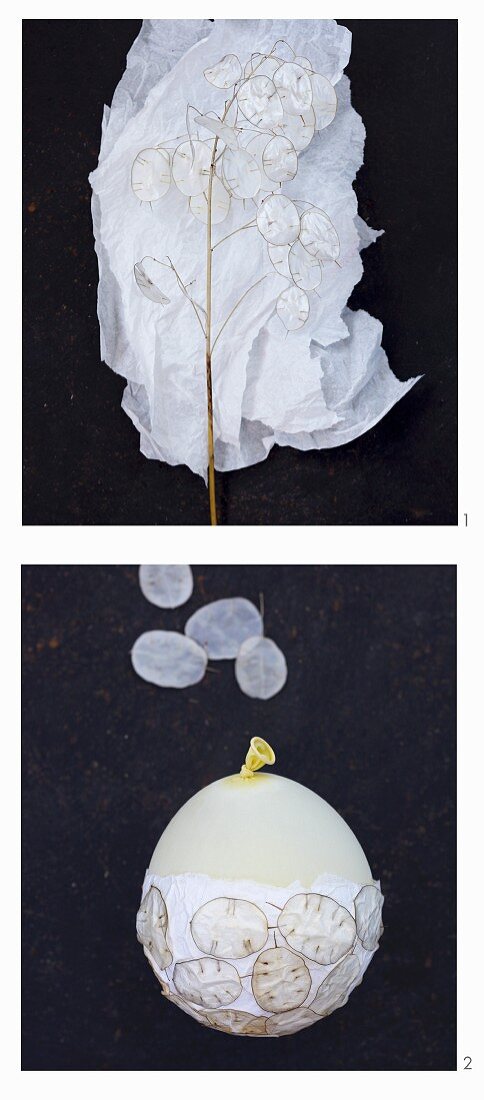 A lantern being made from silk paper and silver leaves