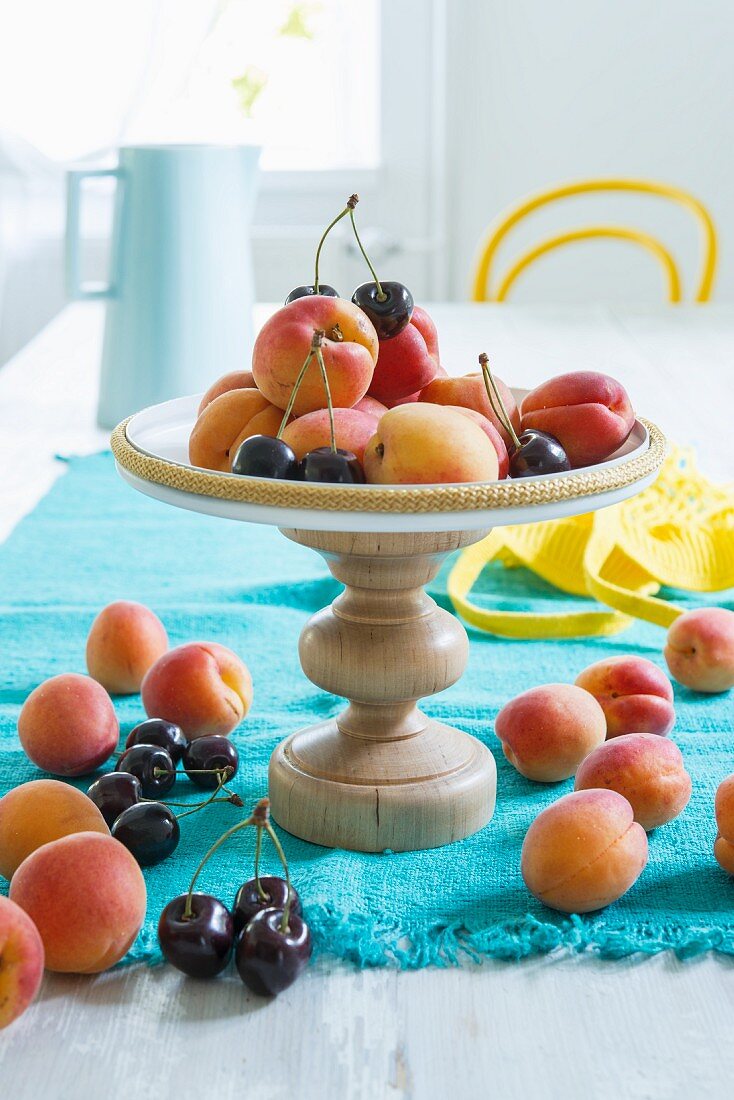 Fruit on a stand made from a wooden base and a pan lid