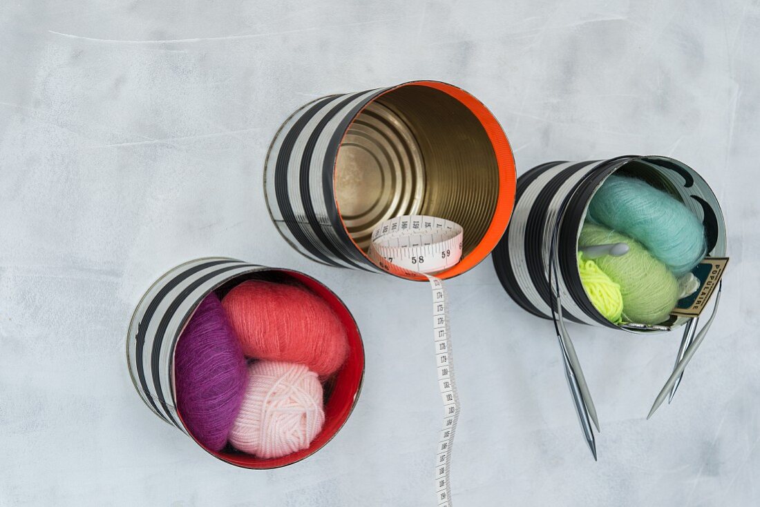 Shells made from tin cans for storing sewing utensils